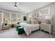 A luxurious main bedroom boasts soft lighting, a cozy sitting area, and elegant decor at 2110 Timball Nw Rd, Atlanta, GA 30318