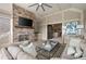 Stylish covered patio featuring a brick fireplace, comfortable seating, and outdoor living space at 2110 Timball Nw Rd, Atlanta, GA 30318