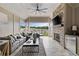 Covered patio with brick fireplace, comfortable seating, and scenic views at 2110 Timball Nw Rd, Atlanta, GA 30318