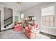 Cozy sitting area with pink chairs, bright windows and modern decor at 2110 Timball Nw Rd, Atlanta, GA 30318