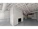 Basement fireplace and utilities painted white in a large unfinished basement area at 3915 Ivy Ne Rd, Atlanta, GA 30342