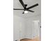 Bright bedroom with ceiling fan and two doorways to adjacent rooms at 3915 Ivy Ne Rd, Atlanta, GA 30342