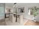 Elegant dining room with glass table, modern light fixture, and unique wine storage at 3915 Ivy Ne Rd, Atlanta, GA 30342