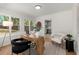 Stylish home office with hardwood floors, natural light and view to the kitchen at 3915 Ivy Ne Rd, Atlanta, GA 30342