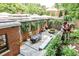 Beautiful brick house with a gorgeous back patio that includes dining, lounging and grilling area with lovely landscaping at 1933 Mclendon Ne Ave # A, Atlanta, GA 30307