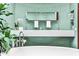 Bright bathroom with soaking tub, dual vanities, and green mosaic tiled walls at 1933 Mclendon Ne Ave # A, Atlanta, GA 30307