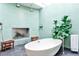Modern bathroom with soaking tub, dual shower heads, and green tile accents at 1933 Mclendon Ne Ave # A, Atlanta, GA 30307