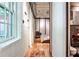 Hallway view of the bedroom showcases an open concept, textured walls, hardwood floors, and modern design at 1933 Mclendon Ne Ave # A, Atlanta, GA 30307