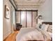 Inviting bedroom with a sliding closet door, modern lighting fixtures, and neutral tones, creating a serene space at 1933 Mclendon Ne Ave # A, Atlanta, GA 30307