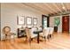 Dining room featuring hardwood floors, modern decor, and plenty of natural light from the window at 1933 Mclendon Ne Ave # A, Atlanta, GA 30307
