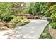 Long driveway leading up to the house; street number visible on stone wall for this lovely home at 1933 Mclendon Ne Ave # A, Atlanta, GA 30307