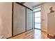 Bright entryway showcases hardwood floors, a sliding door closet, a minimalist design, and ample natural light at 1933 Mclendon Ne Ave # A, Atlanta, GA 30307