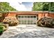 Large garage with many window panels and lush bushes in front in front of the home at 1933 Mclendon Ne Ave # A, Atlanta, GA 30307