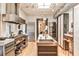 Contemporary kitchen featuring stainless steel appliances, marble counters, and industrial-style design at 1933 Mclendon Ne Ave # A, Atlanta, GA 30307