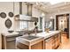 Bright kitchen features stainless steel appliances, marble countertops, and an island with sink at 1933 Mclendon Ne Ave # A, Atlanta, GA 30307