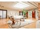 Inviting living room featuring an open layout, skylights, hardwood flooring, and stylish furniture at 1933 Mclendon Ne Ave # A, Atlanta, GA 30307