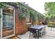 Patio with outdoor dining features an attached brick building at 1933 Mclendon Ne Ave # A, Atlanta, GA 30307