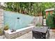 This beautiful patio area boasts a pool with a fountain, dining, and steps to another level at 1933 Mclendon Ne Ave # A, Atlanta, GA 30307