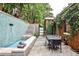 This picturesque patio has a water feature, multiple seating areas, and mature landscaping at 1933 Mclendon Ne Ave # A, Atlanta, GA 30307