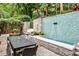 Landscaped patio includes a water feature and outdoor dining at 1933 Mclendon Ne Ave # A, Atlanta, GA 30307