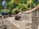 Picturesque backyard patio with stone walkway, outdoor seating, and charming landscape at 1975 River Forest Drive, Marietta, GA 30068