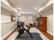 Basement gym is equipped with workout bike, desk and storage at 1975 River Forest Drive, Marietta, GA 30068