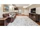 Finished basement living room with stylish decor and a view into a bar area at 1975 River Forest Drive, Marietta, GA 30068