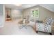 Bright bonus room features neutral tones and comfortable seating near a sunny window at 1975 River Forest Drive, Marietta, GA 30068