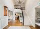 Elegant foyer with hardwood floors, staircase with iron railing, and a soaring ceiling with chandelier at 1975 River Forest Drive, Marietta, GA 30068