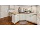 Bright kitchen features custom cabinets, granite countertops and stainless steel appliances at 1975 River Forest Drive, Marietta, GA 30068