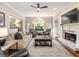 Spacious living room with a fireplace, large windows, and comfortable seating arrangements at 1975 River Forest Drive, Marietta, GA 30068