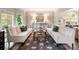 Inviting living room with neutral tones, stylish furniture, and an area rug creating a cozy atmosphere at 1975 River Forest Drive, Marietta, GA 30068