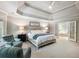 Airy main bedroom features a tray ceiling, sitting area, and ensuite bathroom at 1975 River Forest Drive, Marietta, GA 30068