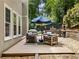 Outdoor living area features patio seating, grill, and lush greenery at 1975 River Forest Drive, Marietta, GA 30068
