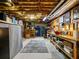 Unfinished basement with exposed ceiling, workbench, and ample storage space at 1975 River Forest Drive, Marietta, GA 30068