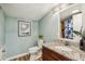 Cozy bathroom with wood-look floors, granite counters, and decorative lighting at 1977 Wee Kirk Se Rd, Atlanta, GA 30316