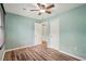 Bedroom featuring wood-look floors, ceiling fan, and two closets at 1977 Wee Kirk Se Rd, Atlanta, GA 30316