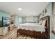 This bedroom includes a TV, an entertainment center, as well as a comfortable king bed with plenty of pillows at 1977 Wee Kirk Se Rd, Atlanta, GA 30316