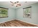 Bedroom with wood-look floors, ceiling fan, and natural light at 1977 Wee Kirk Se Rd, Atlanta, GA 30316