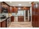 The kitchen features stainless steel appliances, granite countertops, and dark wood cabinets at 1977 Wee Kirk Se Rd, Atlanta, GA 30316