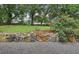 Beautiful stone wall and landscaping elements with a border of small gravel and flowering plants at 1977 Wee Kirk Se Rd, Atlanta, GA 30316