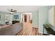 Spacious living room featuring hardwood floors, a ceiling fan, and a TV for entertainment at 1977 Wee Kirk Se Rd, Atlanta, GA 30316