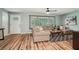 Bright living room featuring a comfortable sectional sofa and large windows at 1977 Wee Kirk Se Rd, Atlanta, GA 30316