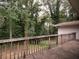 Back deck highlighting a spacious area with wooden railing and an outdoor, nature-filled view at 4135 Sunrise Trail, Atlanta, GA 30349