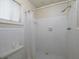 Full bathroom featuring white tiling in shower/tub combination at 4135 Sunrise Trail, Atlanta, GA 30349
