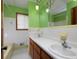 Bathroom with double sink and window at 4135 Sunrise Trail, Atlanta, GA 30349