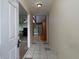 Inviting foyer features tiled flooring, neutral walls, and a glimpse into the spacious living area with lots of light at 4135 Sunrise Trail, Atlanta, GA 30349