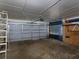 Spacious garage featuring a large door, with ample room for parking and storage at 4135 Sunrise Trail, Atlanta, GA 30349