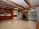 Inviting living room with brick fireplace, wood accents, access to an outdoor deck, and lots of natural light at 4135 Sunrise Trail, Atlanta, GA 30349