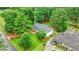 Scenic aerial view of the home with lush green surroundings, including a well-maintained lawn and mature trees at 4188 Fontana Ct, Atlanta, GA 30084